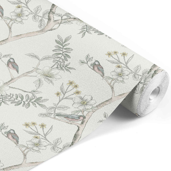 cream_A roll of wallpaper with a floral pattern featuring birds among the foliage, predominantly in pastel colors.