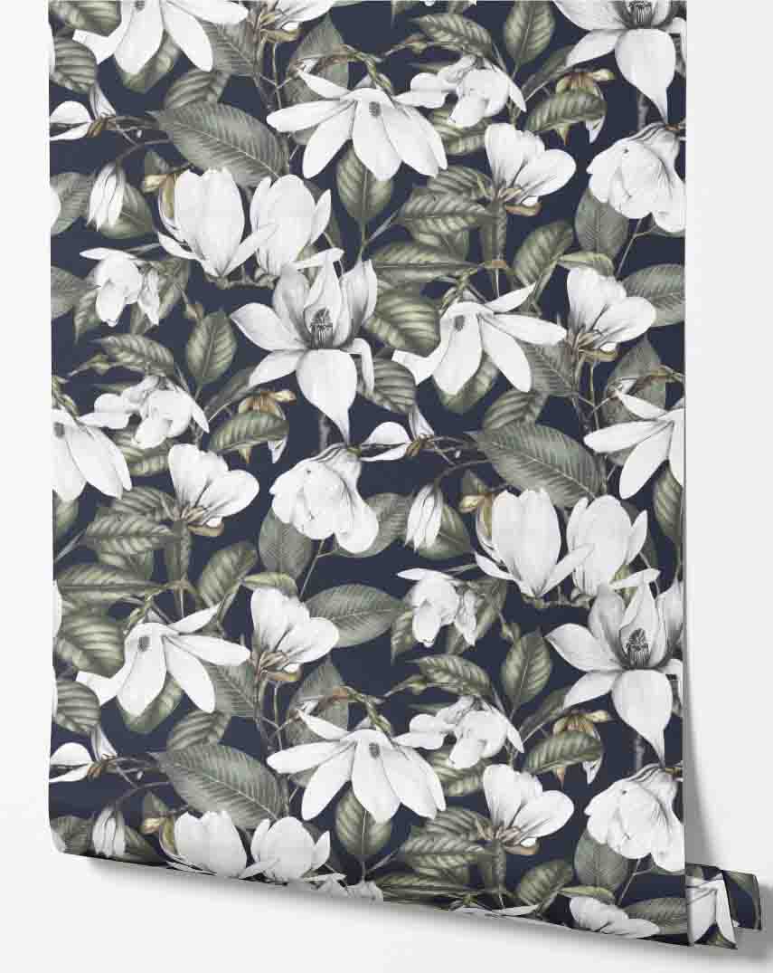 navy_wallpaper displaying a repeated pattern of white magnolia flowers and green leaves on a navy background.