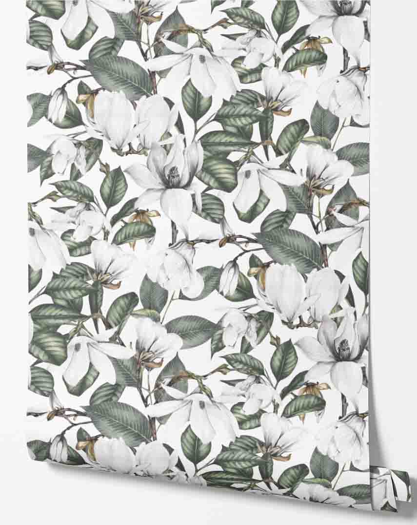 white_wallpaper displaying a repeated pattern of white magnolia flowers and green leaves on a white background.