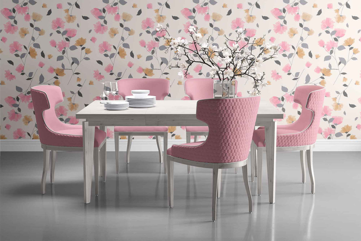cream_delicate floral wallpaper featuring a soft and subtle color palette. The design includes an array of stylized flowers in shades of pink and brown, interspersed with elegant leaf patterns, creating a traditional yet charming aesthetic in a formal dining room with pink chairs
