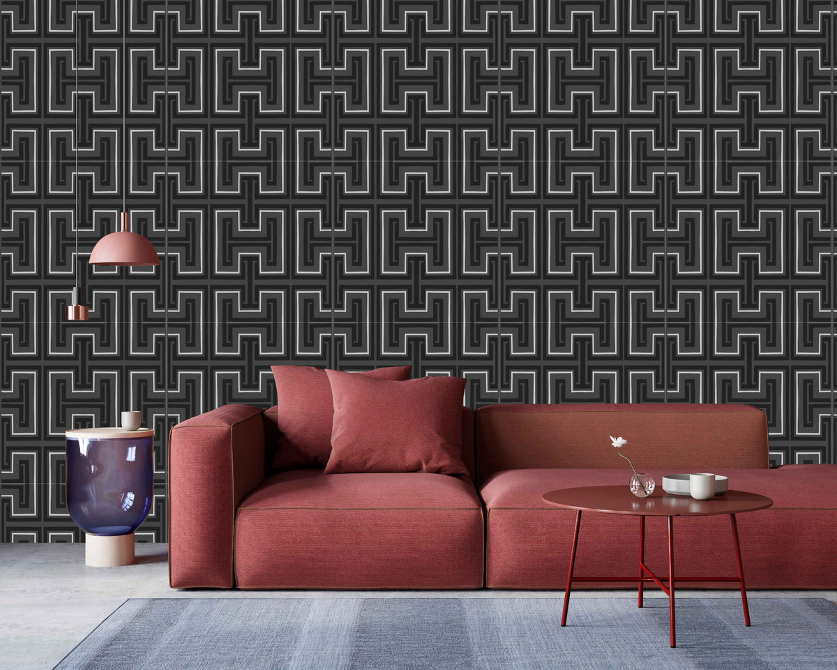 charcoal_Red sofa in a room with geometric patterned wallpaper