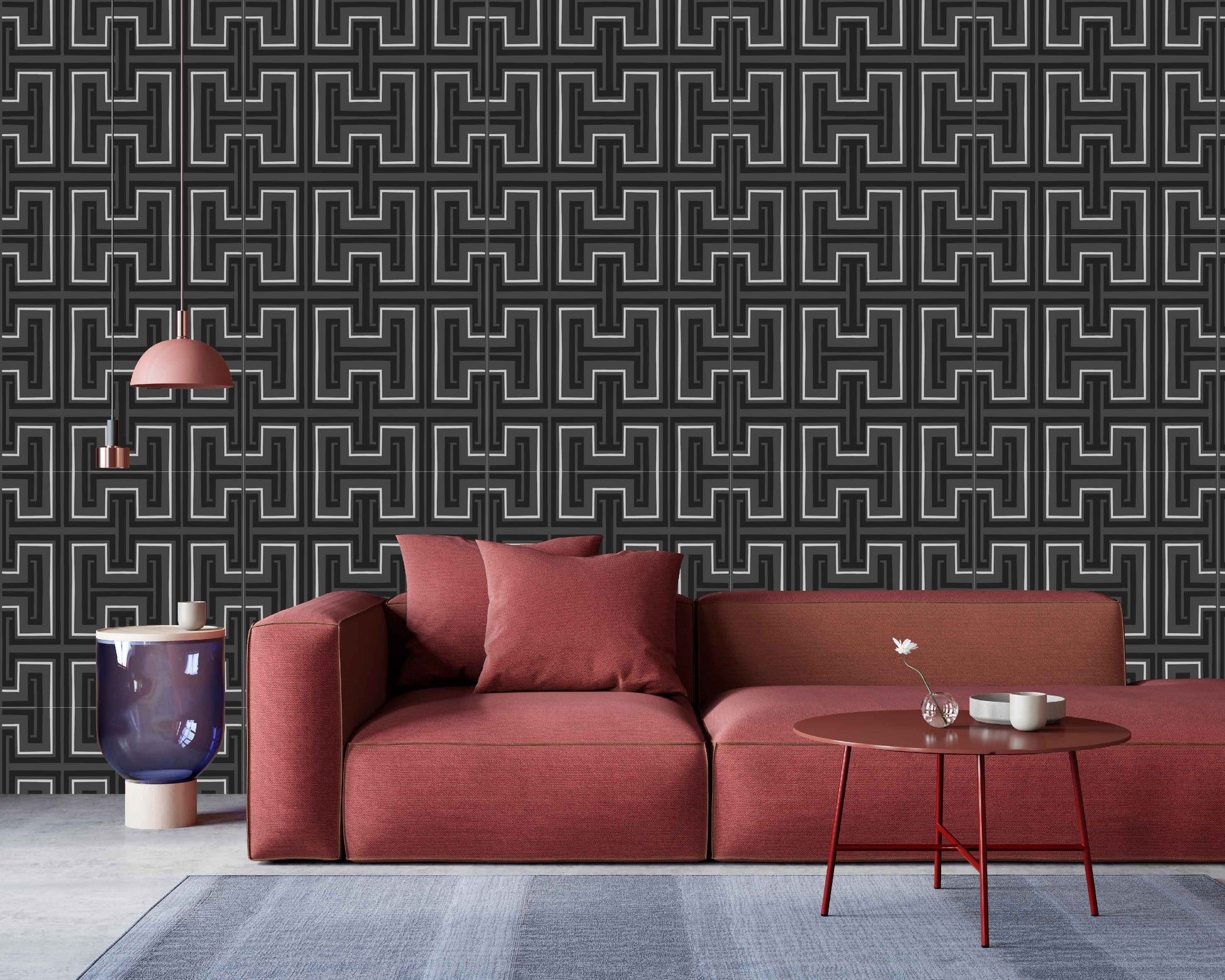 charcoal_Red sofa in a room with geometric patterned wallpaper