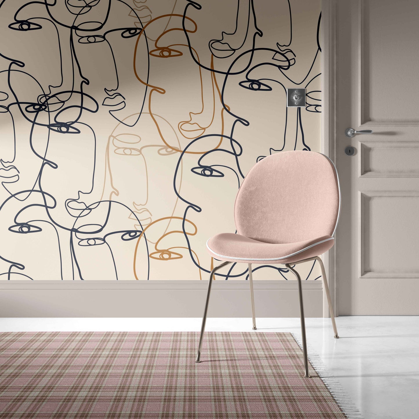 tan_A wallpaper with a pattern of abstract faces in black and gold on a beige background.
