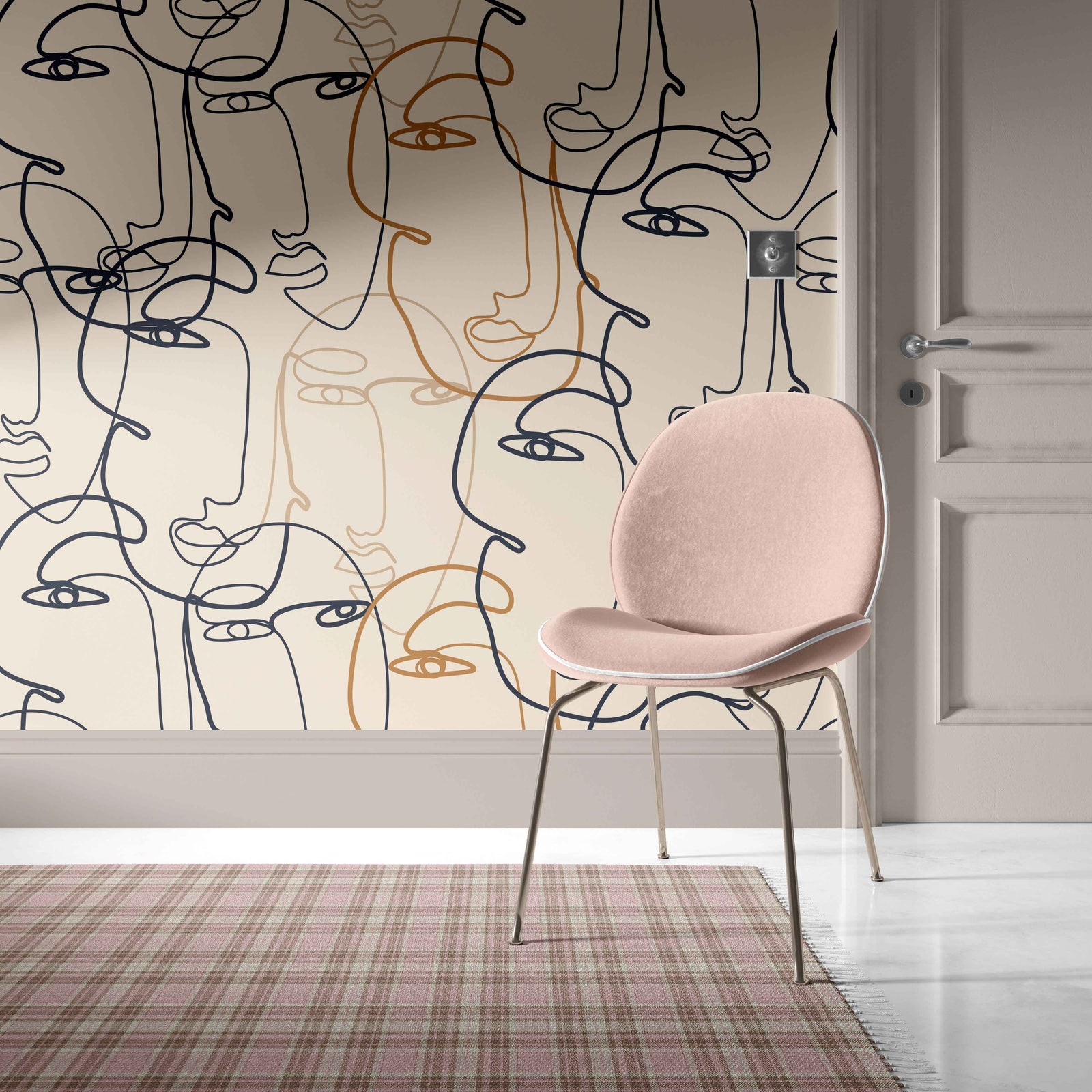 tan_A wallpaper with a pattern of abstract faces in black and gold on a beige background.