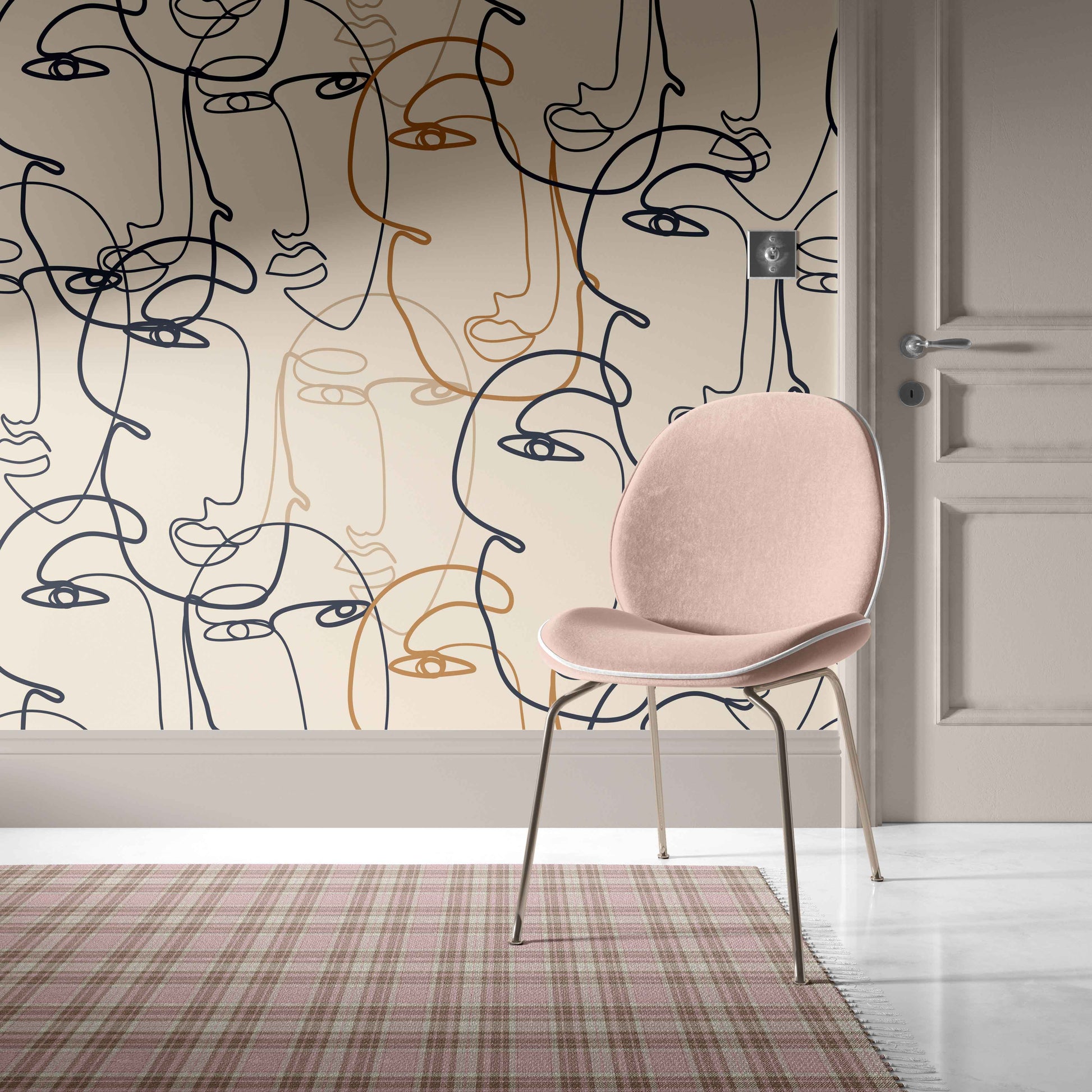tan_A wallpaper with a pattern of abstract faces in black and gold on a beige background.
