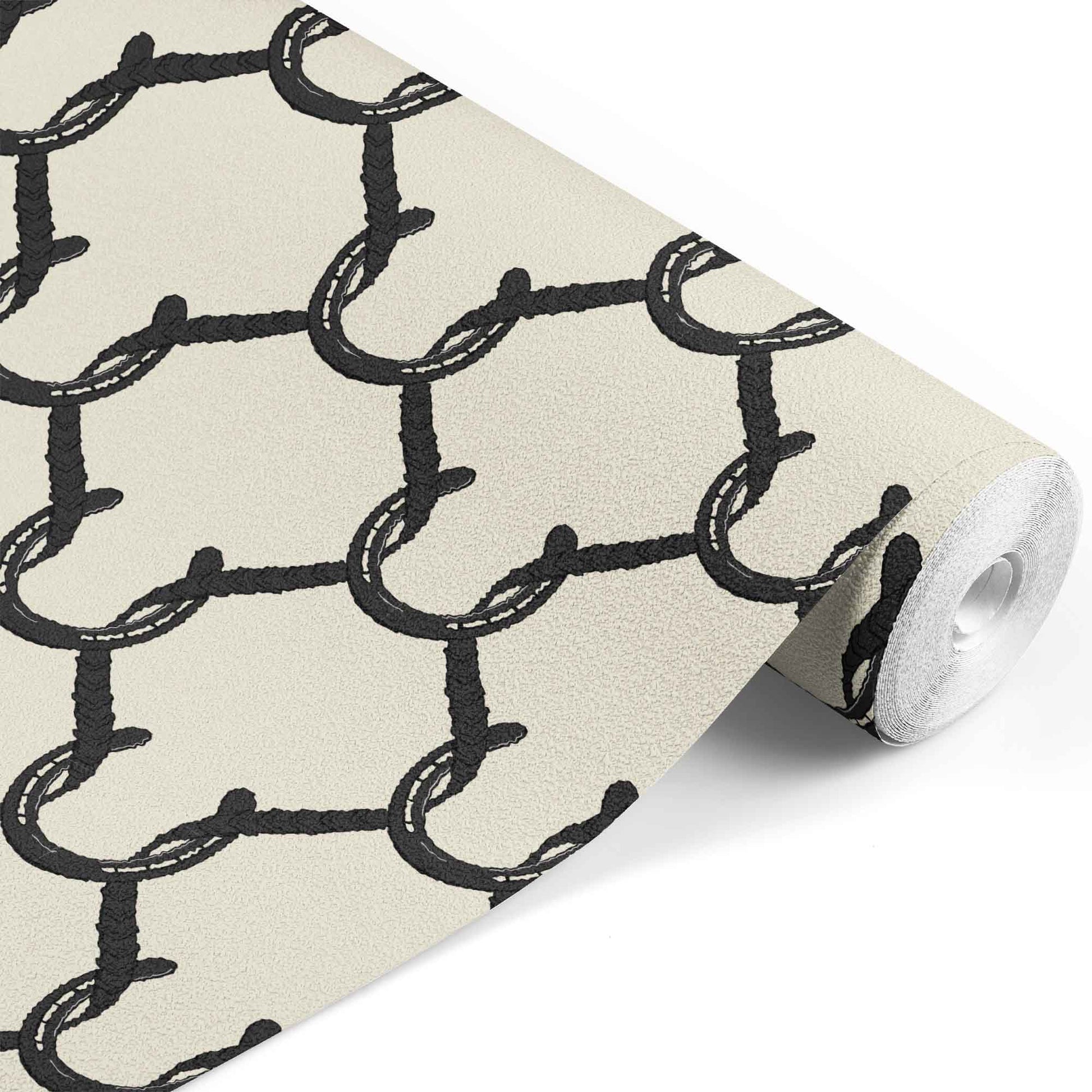 black_A roll of wallpaper with a beige and black geometric pattern featuring shapes resembling horseshoes, consistent with equestrian themes.