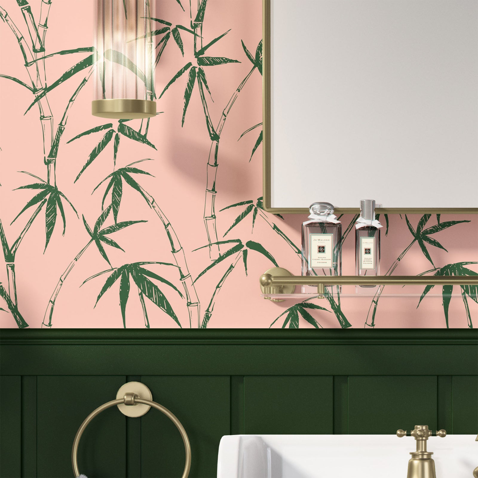 dark-moss_traditional wallpaper featuring a sketch of bamboo leaves and stems in green on a pink background in a bathroom