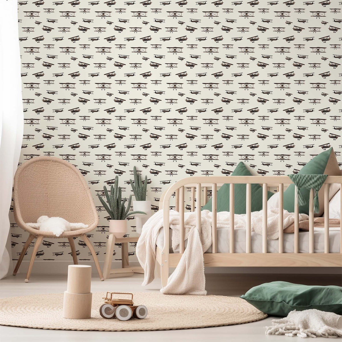 cream_A wallpaper featuring a repeated pattern of vintage airplanes in brown color on a cream background in a toddler room.