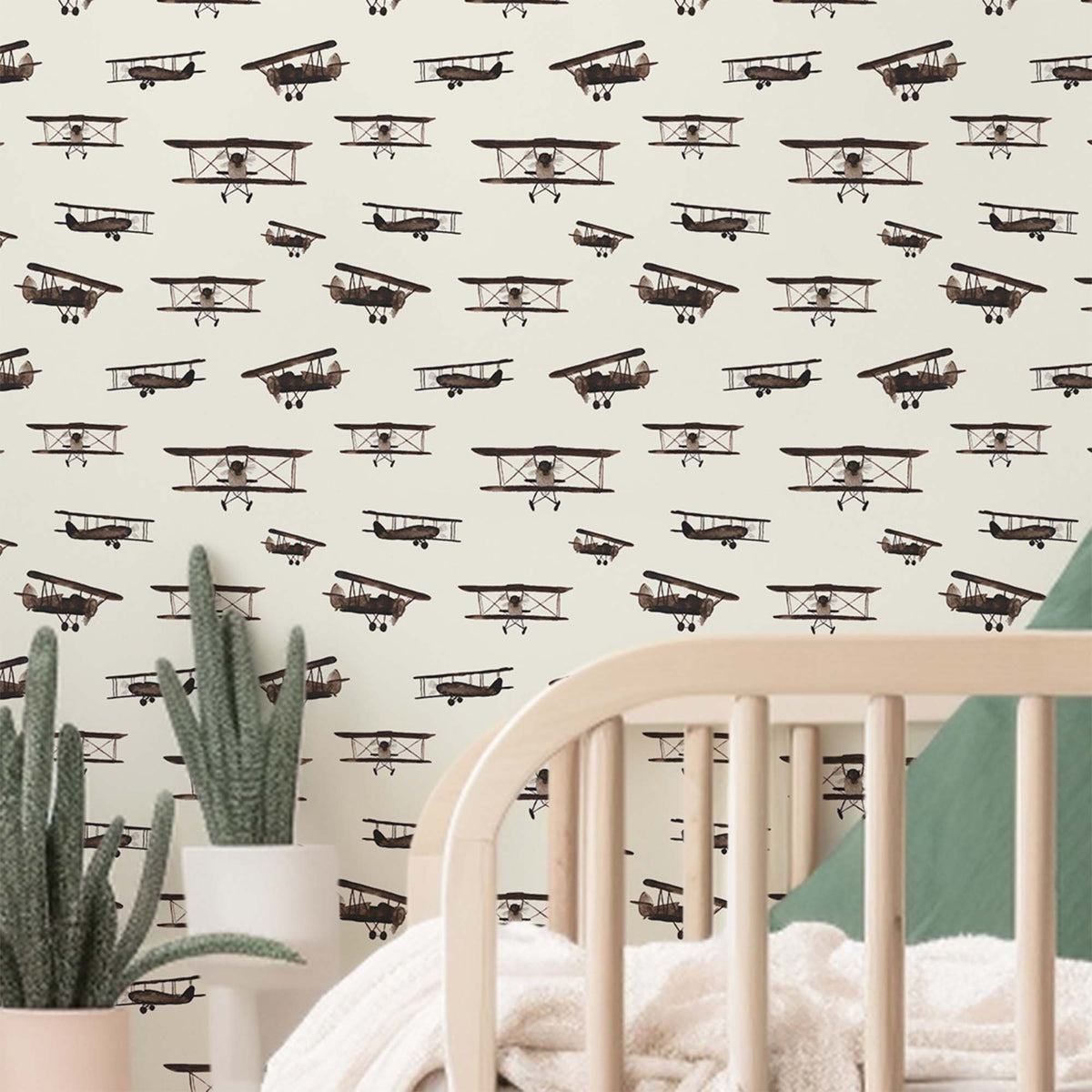 cream_A wallpaper featuring a repeated pattern of vintage airplanes in brown color on a cream background.
