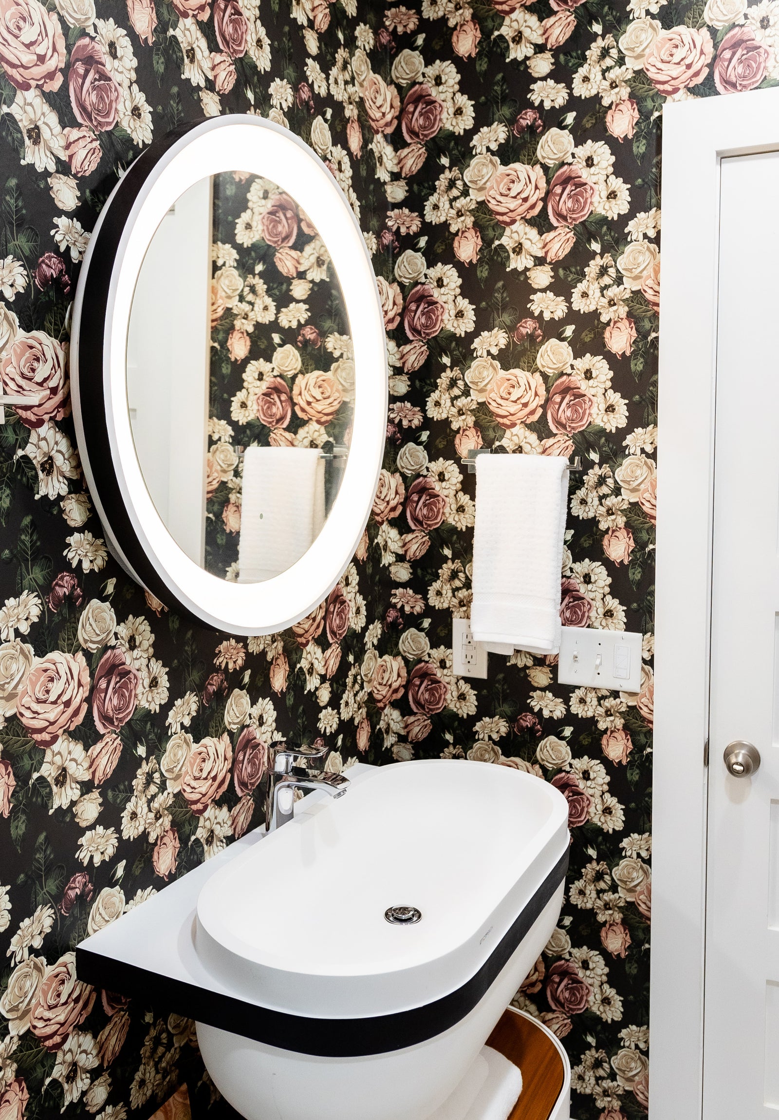 black_floral wallpaper featuring dusty rose colored roses and other flowers on a black background.