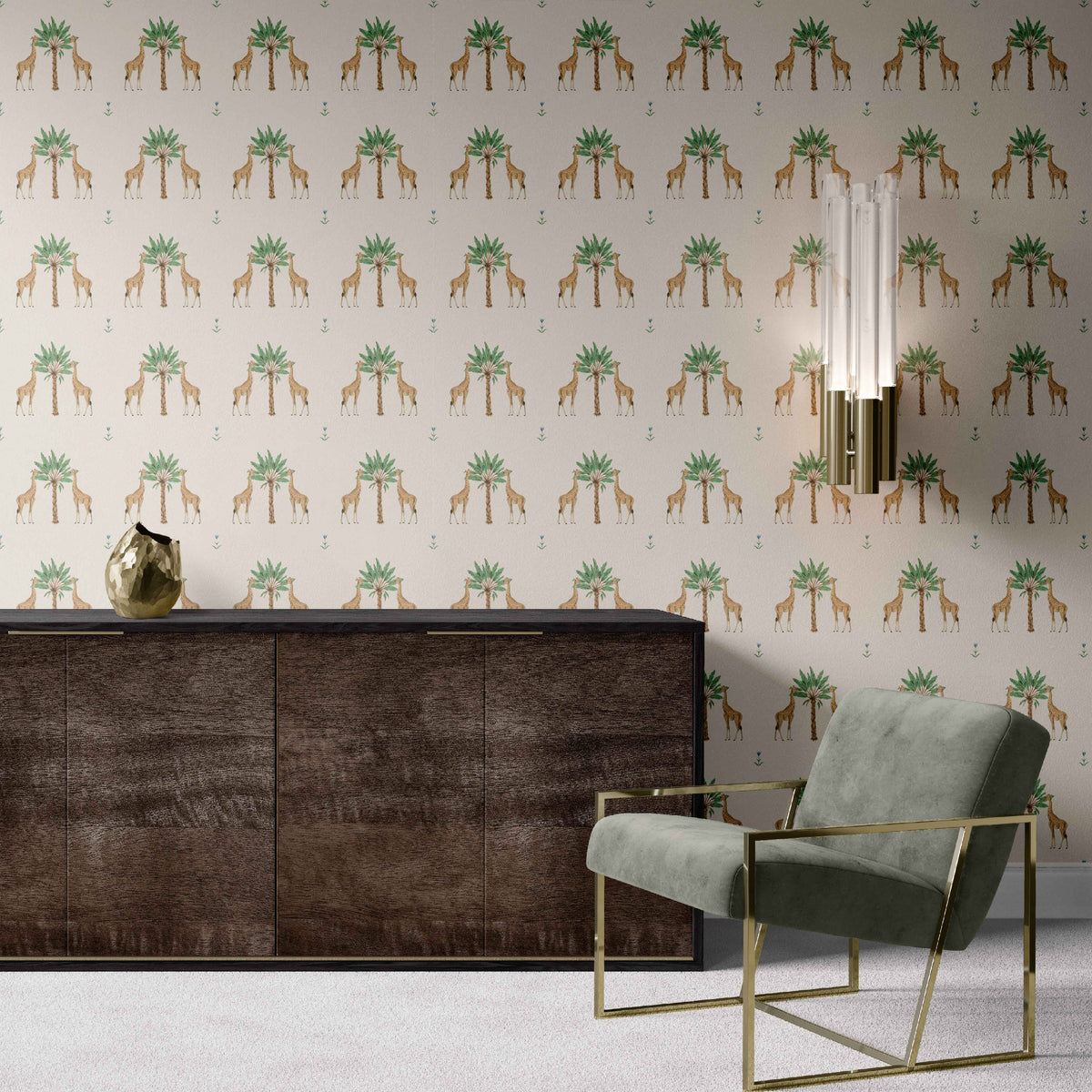 cream_Whimsical safari-inspired pattern featuring pairs of giraffes flanking stylized palm trees, with small scattered florals on a soft neutral background for a playful yet refined look in a room with a sage green chair.