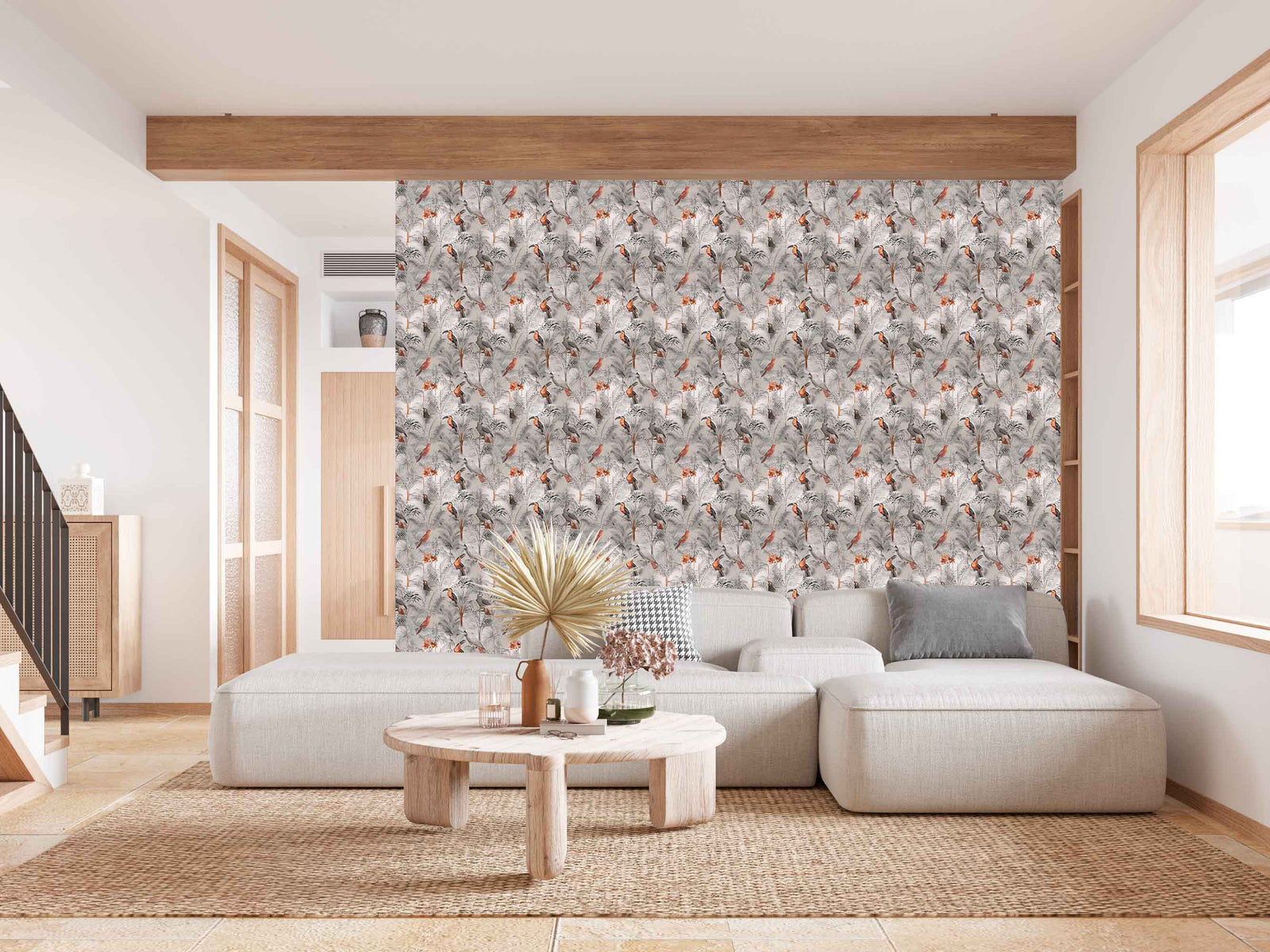 taupe_A wallpaper pattern featuring a tropical bird pattern with gray, white, and red colors on a taupe background in a living room with a cream couch.
