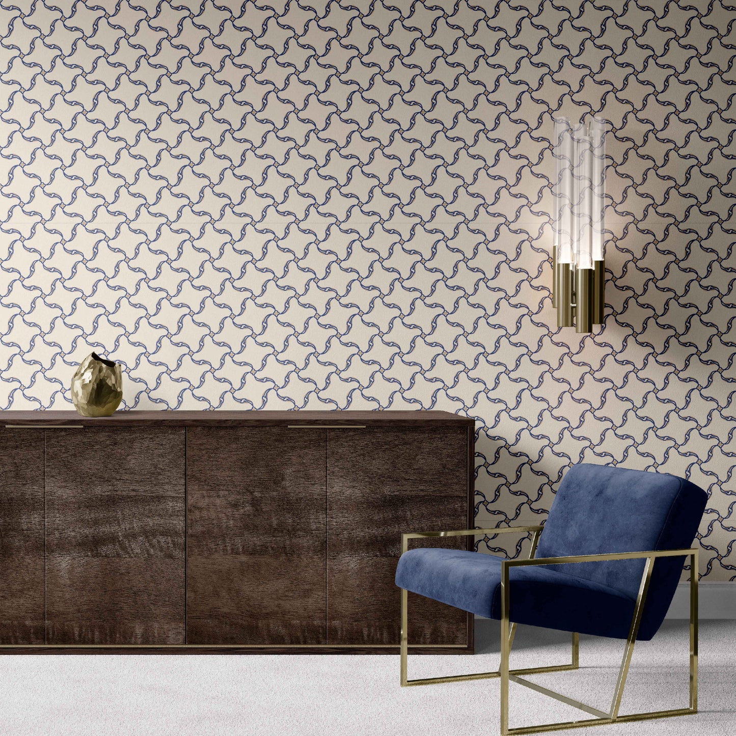 navy_A section of wallpaper with a geometric pattern featuring swirls and floral-like designs, predominantly in navy tones on an off white background in a room with a blue chair and wood dresser. 