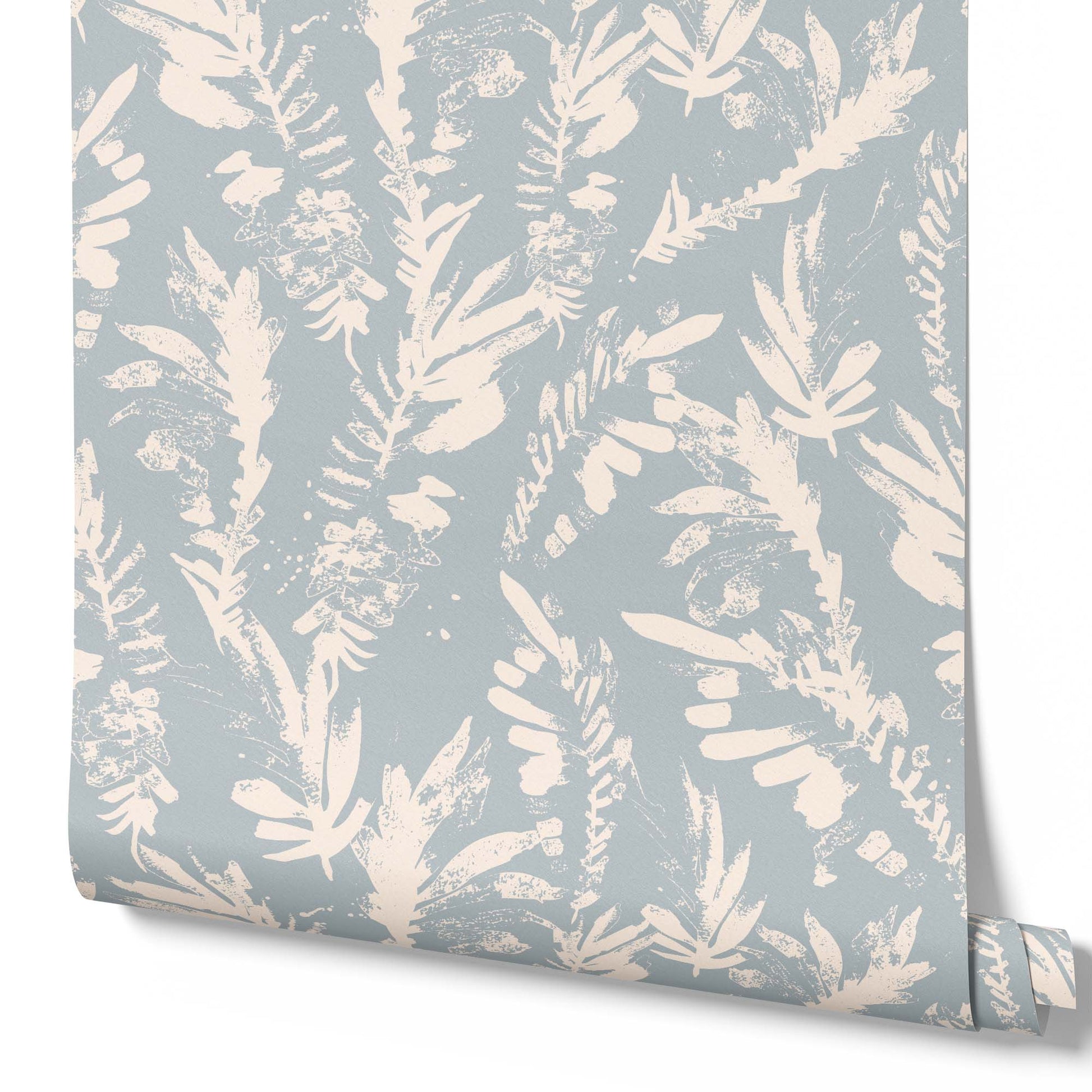 light-blue_A section of floral wallpaper with a pattern of off white wildflowers on a blue background.
