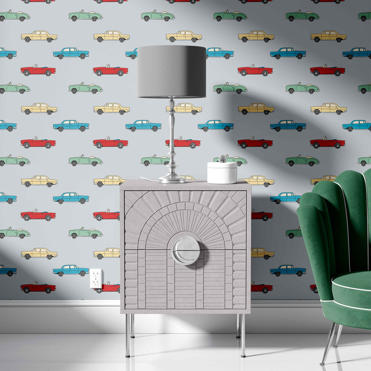 grey_A wallpaper with a pattern featuring vintage cars in colors blue, red, yellow, and green on a grey background in a room with a green couch.