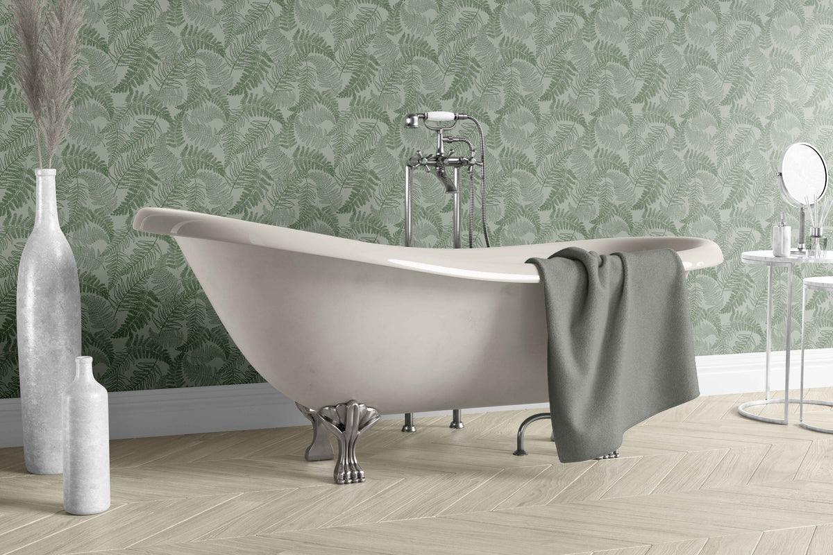 green_A green and light green floral wallpaper in a bathroom with a white bathtub. 
