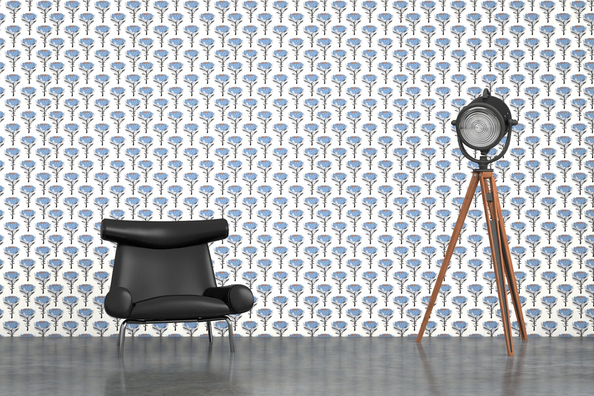 cream_A wallpaper pattern featuring blue floral designs on a lighter background in a scene with a black chair
